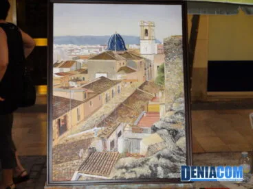 La Iglesia de la Asunción representada en un paisaje expuesto en Art al Carrer