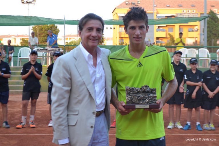Pedro Cachin collecting trophy