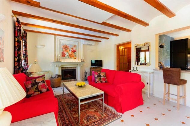 sala de estar chimenea quality rent a villa
