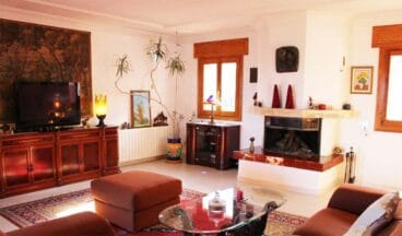 Comedor con chimenea Stirling Ackroyd Spain