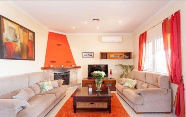 sala con chimenea vacation villas