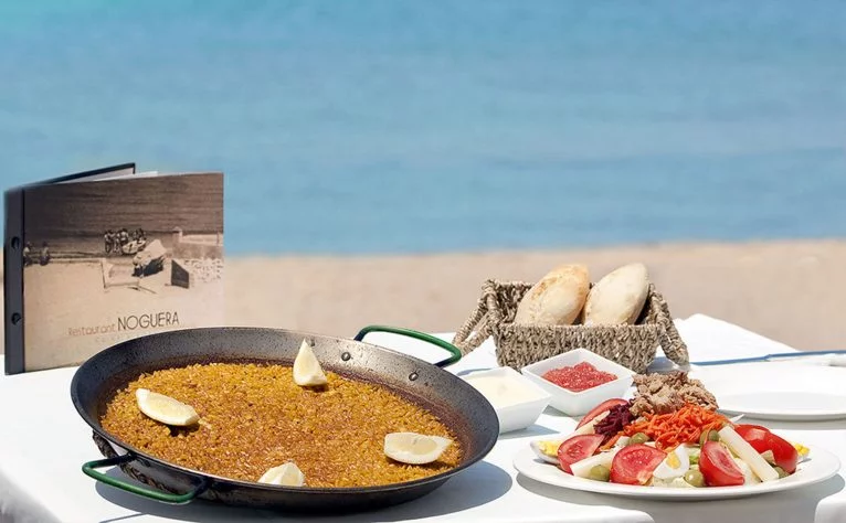 Comer arroz en la playa en Dénia - Restaurant Noguera