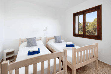 Dormitorio doble con dos camas individuales