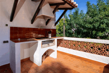 Zona de barbacoa exterior en la terraza