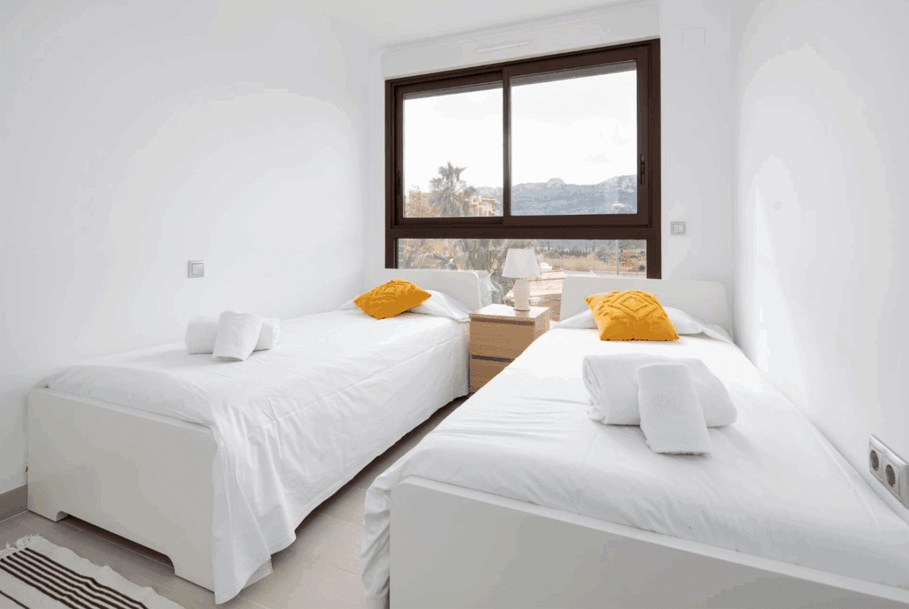 Dormitorio doble con dos camas individuales