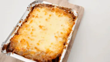 Pide tu ración de lasaña en Dénia – Tradició