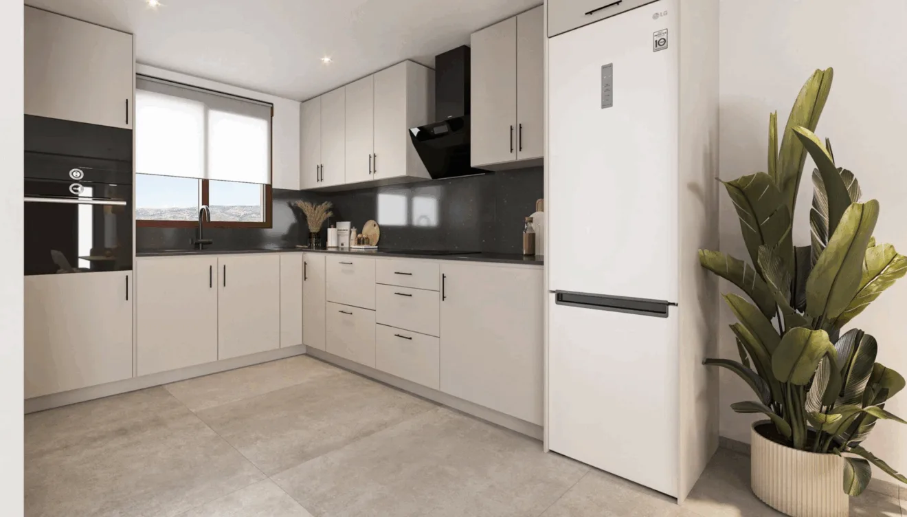 Cocina moderna totalmente equipada integrada en un espacio funcional