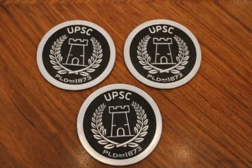 Logo de la Unitat de Prevenció i Seguretat Ciutadana de la Policía Local de Dénia con la la torre del Gerro de Dénia