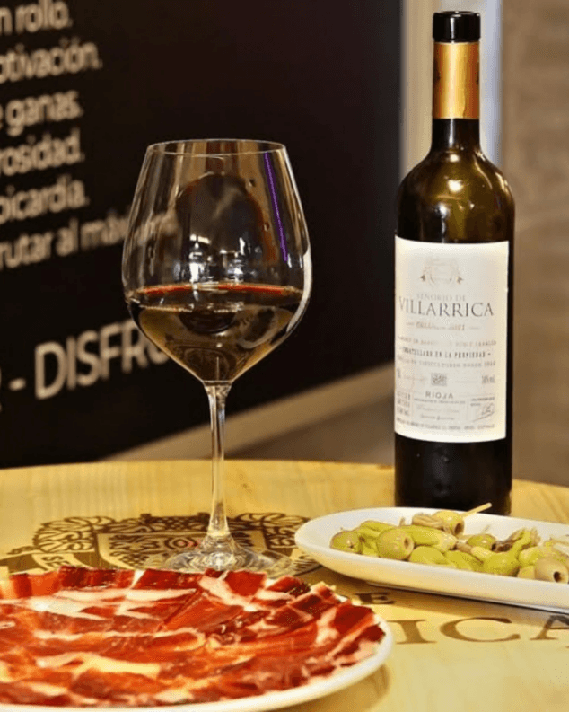 maridaje perfecto de jamon iberico artesanal con vino tinto reserva
